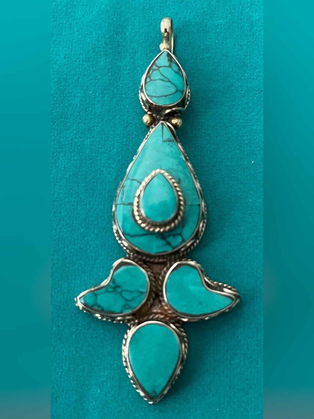 TIBETAN STYLE TURQUOISE PENDANT/ HANDCRAFTED SILVER WORK W/ BRASS BEAD ROPING 3“